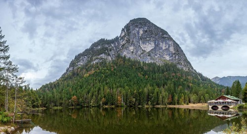 Pflegersee with inn under a cloudy sky, Garmisch-Partenkirchen, Werdenfelser Land, Upper Bavaria,