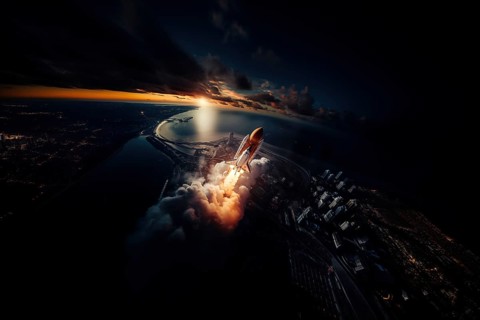 Aerial view of a rocket shuttle carrier launch at sunrise over an ocean coast. The rocket is