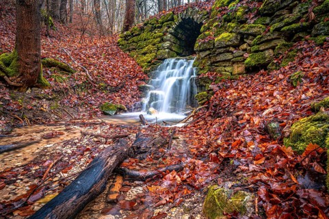 Waterfall in the Rautal forest in Jena in winter, Jena, Thuringia, Germany, Europe
