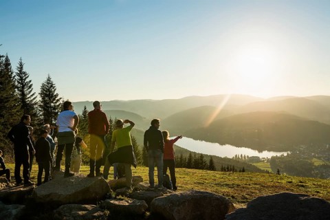 Hiking group, view from Hochfirst to Titisee and Feldberg, sunset, near Neustadt, Black Forest,