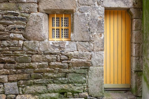 House facade with yellow door and yellow windows, Roscoff, Finistere, Brittany, France, Europe