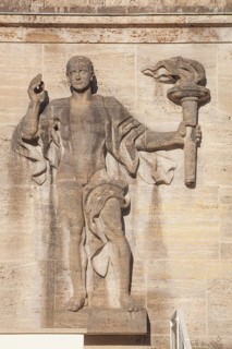 Bearer of the Olympic flame at the entrance portal, Olympic Stadium, 1936 venue of the Winter