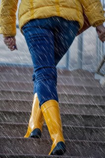 Woman with yellow wellies