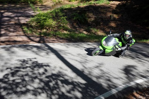 Sporty motorcyclist on a trip into the countryside (Edenkoben Valley, Palatinate Forest)