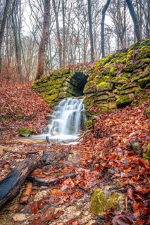 Waterfall in the Rautal forest in Jena in winter, Jena, Thuringia, Germany, Europe