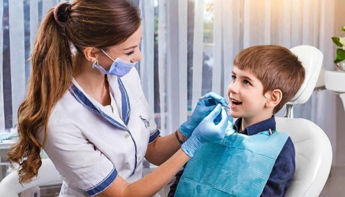 AI generated, dentist treats little boy, dentist, blonde, 30, 35, years, dental treatment,
