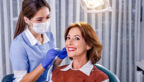 AI generated, dentist treats a middle-aged woman, dentist, blonde, 30, 35, years, dental treatment,