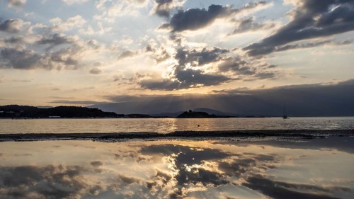 Morning atmosphere on the beach at sunrise, reflection, panoramic shot, Lopar, island of Rab,