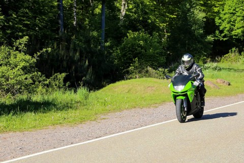Sporty motorcyclist on a trip into the countryside (Edenkoben Valley, Palatinate Forest)