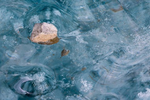 Trapped stone in an ice structure, glacier cave, winter, Morteratsch glacier, Pontresina, Engadine,
