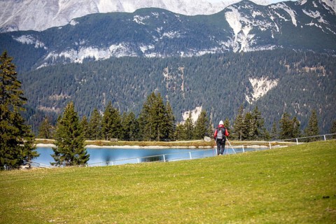 Woman hiking at the Kaltwassersee lake in Seefeld, Tyrol