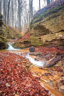 Waterfall in the Rautal forest in Jena in winter, Jena, Thuringia, Germany, Europe