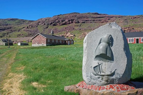 Stone memorial to Erik the Red, individual houses, meadow and mountain, Igaliku, North America,