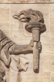 Bearer of the Olympic flame at the entrance portal, Olympic Stadium, 1936 venue of the Winter