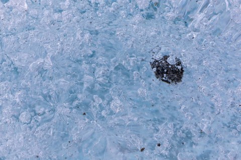 Trapped stone in an ice structure, glacier cave, winter, Morteratsch glacier, Pontresina, Engadine,