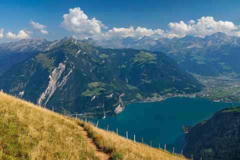 View from Niederbauen Kulm (1923m) to Bristenstock and Flueelen, Lake Lucerne, Canton Uri,