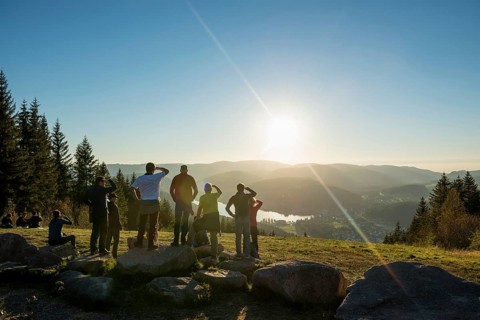 Hiking group, view from Hochfirst to Titisee and Feldberg, sunset, near Neustadt, Black Forest,