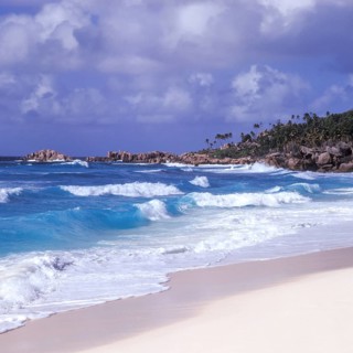 Waves in a storm on La Digue at Grand Anse beach, Seychelles, Africa