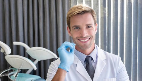 A friendly dentist in his practice, 35, portrait, attractive, attractive, friendly, friendly,