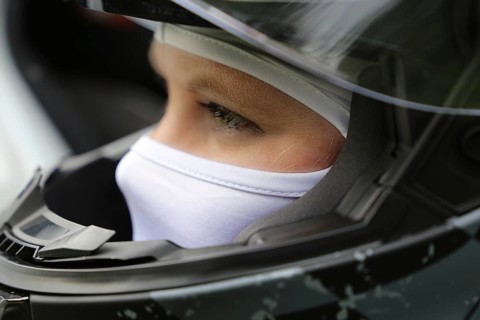 Racer with helmet and balaclava