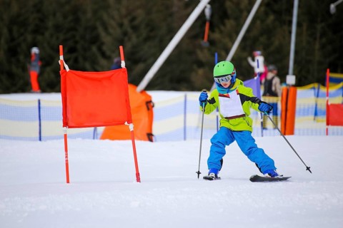 Child at a guest ski race in a ski resort