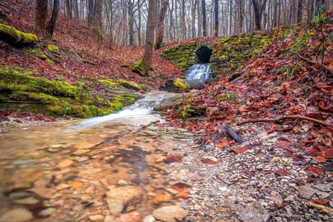 Waterfall in the Rautal forest in Jena in winter, Jena, Thuringia, Germany, Europe