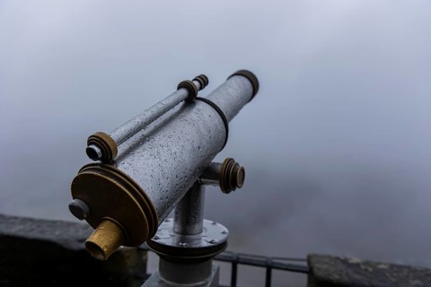 Winter atmosphere at the mountain fortress. Paying telescope with water drops, Koenigstein, Saxony,