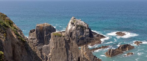 Rocky rugged coastline near Azenha do Mar, Alentejo Littoral, Portugal, southern Europe with white