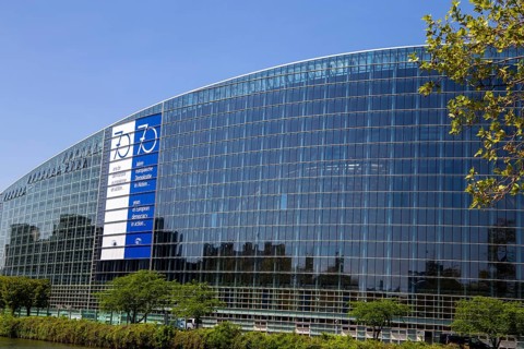 The back of the European Parliament in Strasbourg On the glass facade you can see a huge banner