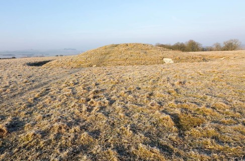 Bronze Age bowl barrow on Windmill Hill, a Neolithic causewayed enclosure, near Avebury, Wiltshire,