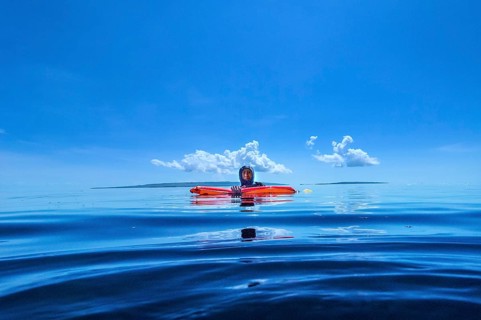 Dive guide with dive buoy, Wakatobi Dive Resort, Sulawesi, Indonesia, Asia