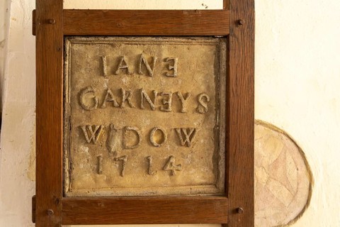 Historic village parish church at Kenton, Suffolk, England, UK lead roof tile mason's panel dated