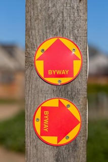 Macro close up of Byway signs on fencepost, Sutton, Suffolk, UK