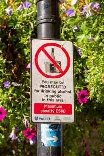 Sign warning about prosecution for drinking alcohol in public area, Newbury, Berkshire, England, UK