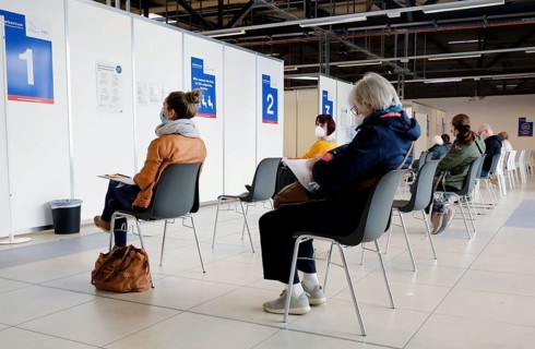 Vaccinees in the waiting room of a vaccination centre, Schoenefeld, 26.02.2021