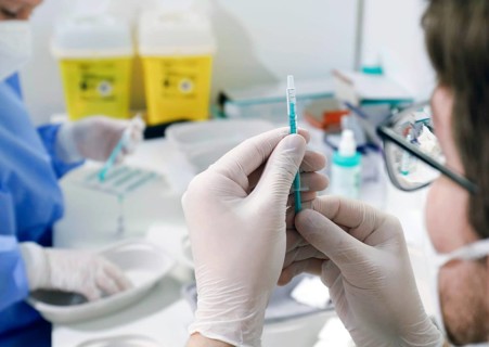 Syringes are filled with the Covid19 Biontech Pfizer vaccine Comirnaty in a vaccination centre by