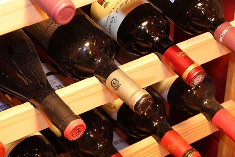 Wine cellar with red wine bottles (editorial)
