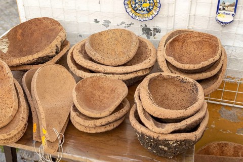 Close up of shop display of bowls made from cork oak tourist souvenir products on sale, city of