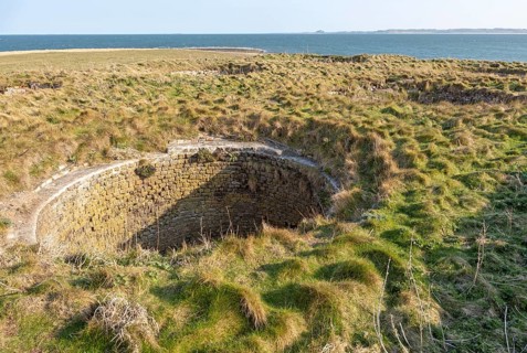 Top of old lime kilns on Holy Island, Northumberland, England, UK view south of coastline