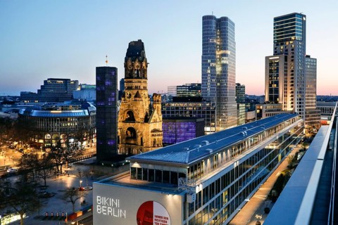 View of Breitscheidplatz in the evening with the Bikini building, the Kaiser Wilhelm Memorial