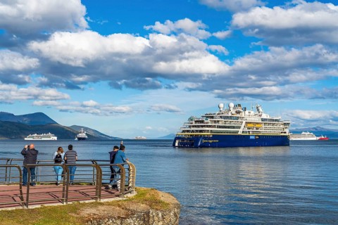 People watching cruise ships in the harbour at the Beagle Channel, Ushuaia, Tierra del Fuego