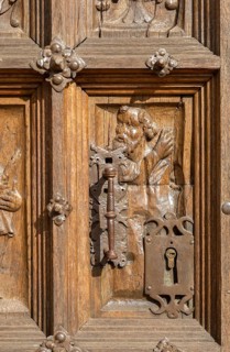 Historic carvings on wooden church door, Santa Maria la Mayor, Ezcaray, La Rioja, Spain, Europe