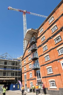Tall crane at construction site of the 'Wine Rack' building, Waterfont, Wet Dock, Ipswich, Suffolk,