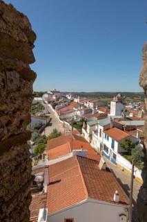 View over rooftops of whitewashed houses and streets in the small rural settlement village of