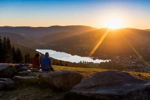 Elderly couple, view from Hochfirst to Titisee and Feldberg, sunset, near Neustadt, Black Forest,