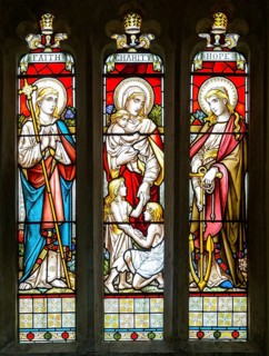 Stained glass window Faith, Charity, Hope church of Saint Swithin, Combe, Berkshire, England, UK