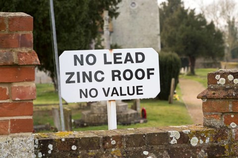 No Lead Zinc Roof No Value sign outside church to deter potential thieves who target churches for