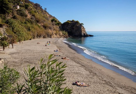 Sandy beach of Playa de Maro, near Nerja, Andalusia, Spain with calm Mediterranean Sea, out of