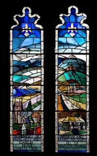Modern stained glass window in church of Saints Peter and Paul, Marden, Wiltshire, England, UK by