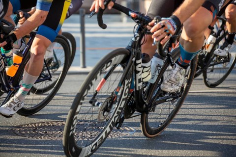 Close-up of a cycle race with a KAZE racing bike in the foreground